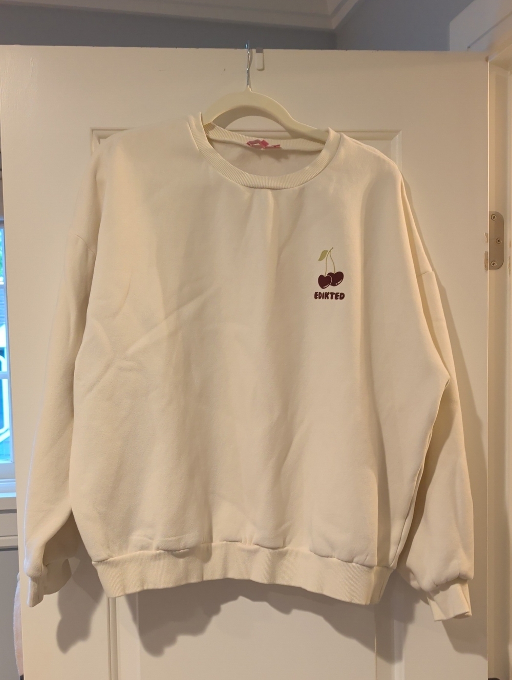 Edikted Cream Crewneck Sweater with Cherry Patch